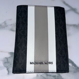Michael Kors passport holder, black leather. Never used!